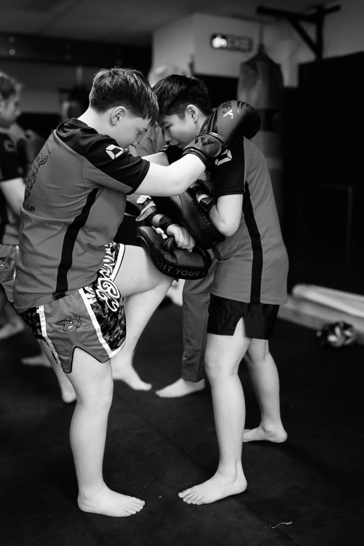 Two young students practising kickboxing together